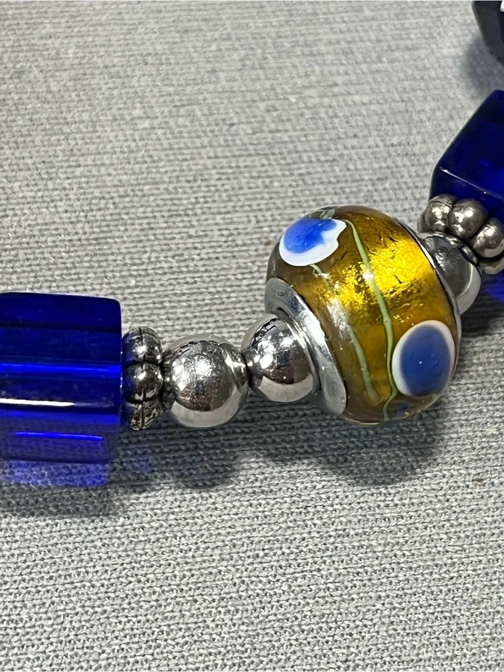 NWOT beautiful blue and yellow plastic beads with silver tone beads in between.